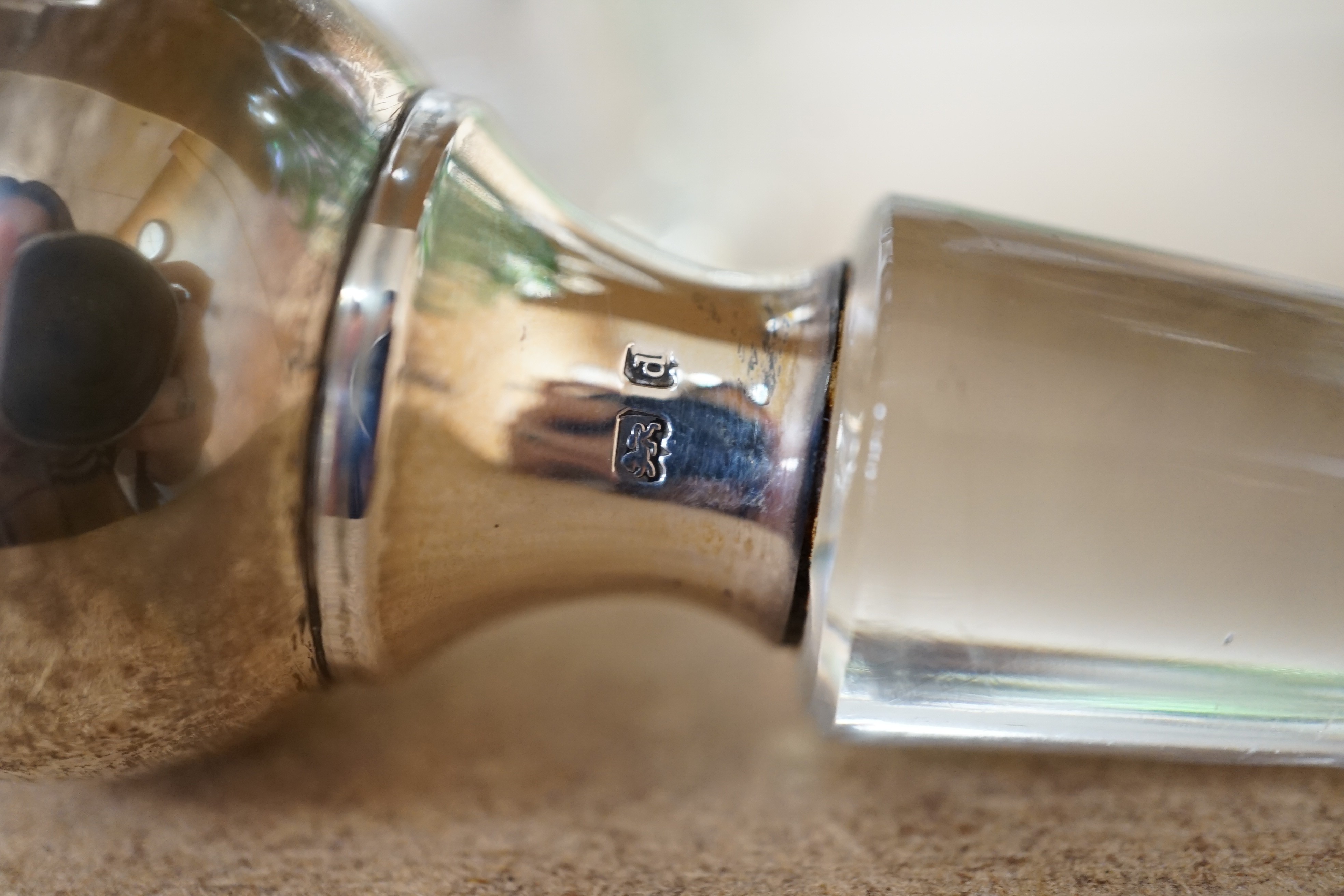 A late Victorian Art Nouveau silver mounted glass claret jug and stopper, D & M Davis, Birmingham, 1900, the glass with ribbed green swags, height 20.7cm.